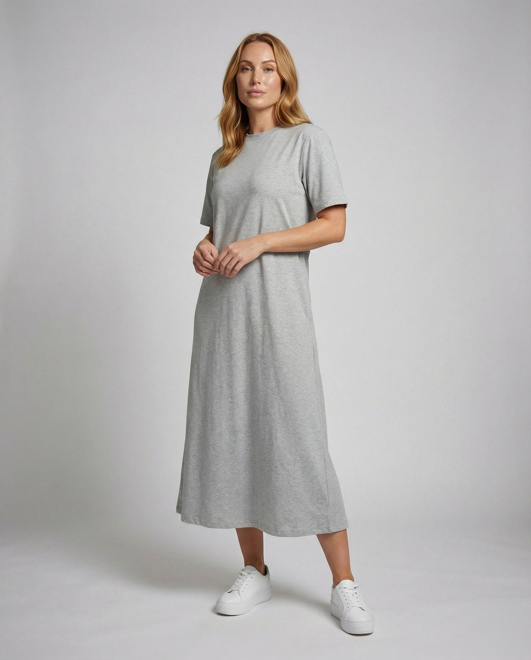 Women's black mock neck oversized maxi dress with side split, short sleeves. Comfortable & versatile for summer.