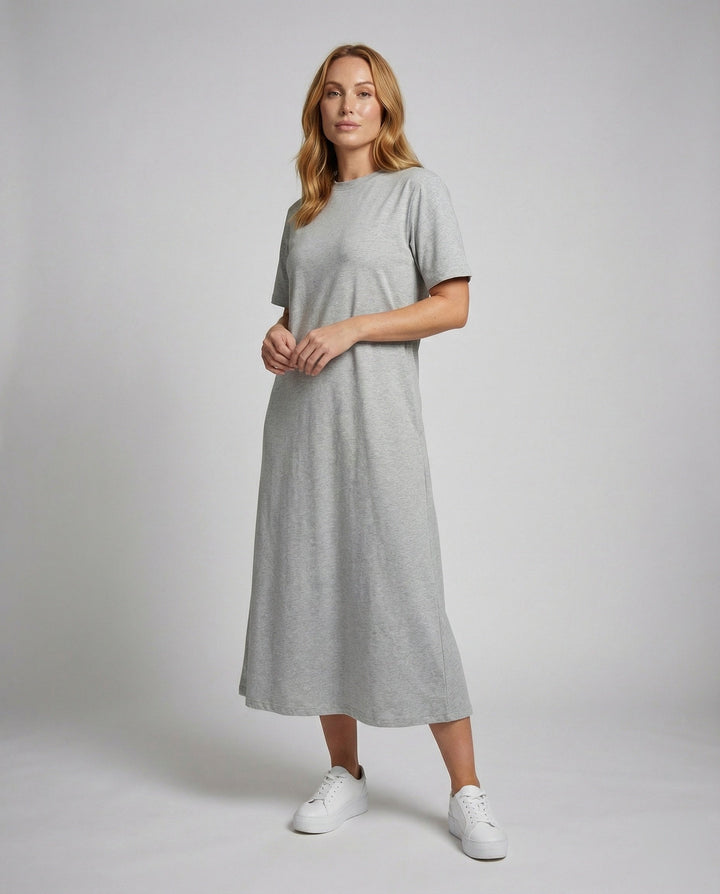 Women's black mock neck oversized maxi dress with side split, short sleeves. Comfortable & versatile for summer.