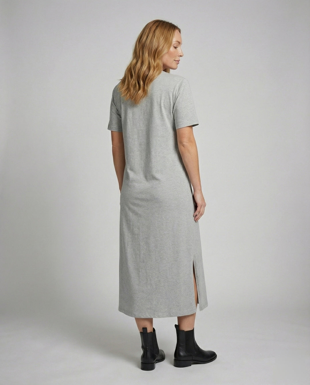 Stylish women's short sleeve oversized maxi dress in navy, featuring a mock neck and chic side split.