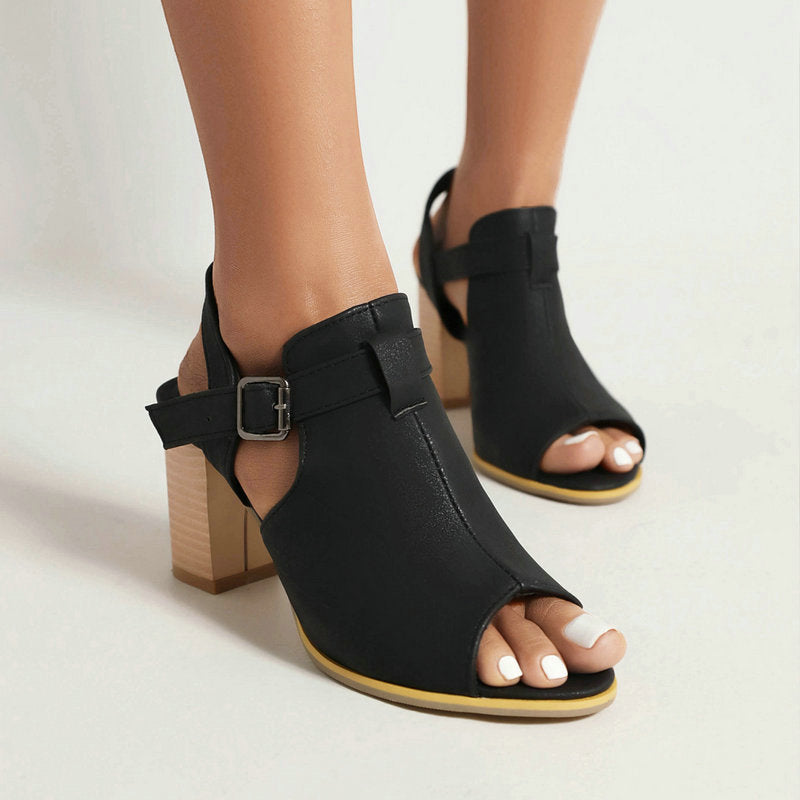 High-angle view of women's green open-toe block heels, emphasizing the adjustable strap and open toe design.