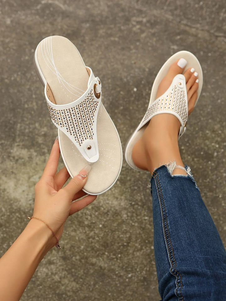 Detail of the non-slip sole on white women's comfort orthopedic sandals
