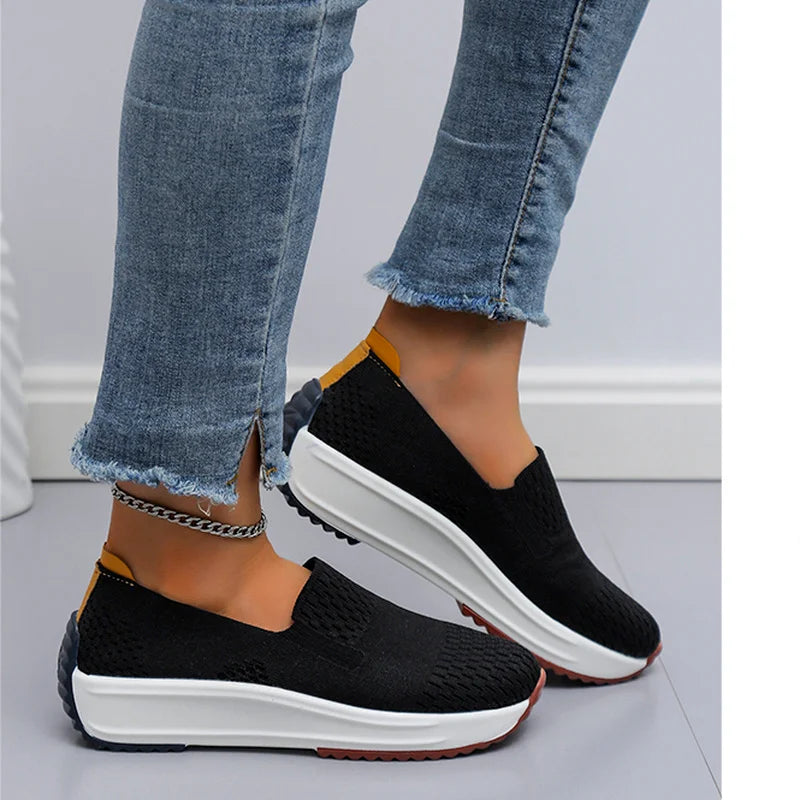 Group shot of various colors of women's orthopedic slip-on walking shoes in a row, fashion sneakers