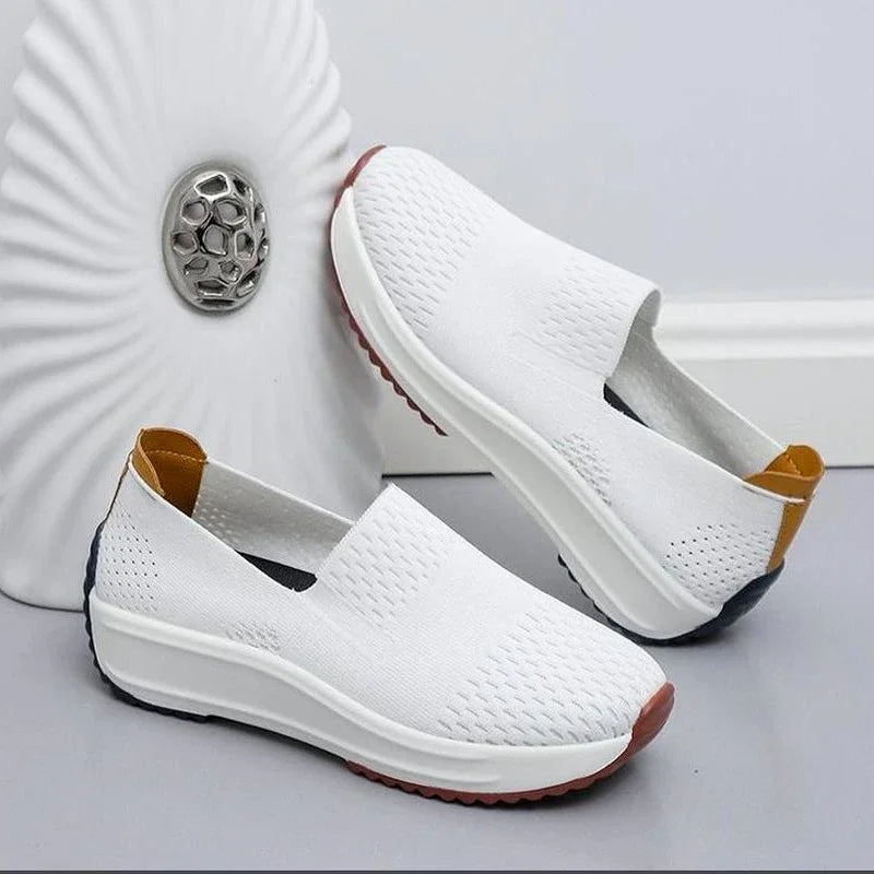 Underside view of women's orthopedic slip-on walking shoe sole, highlighting anti-slip traction