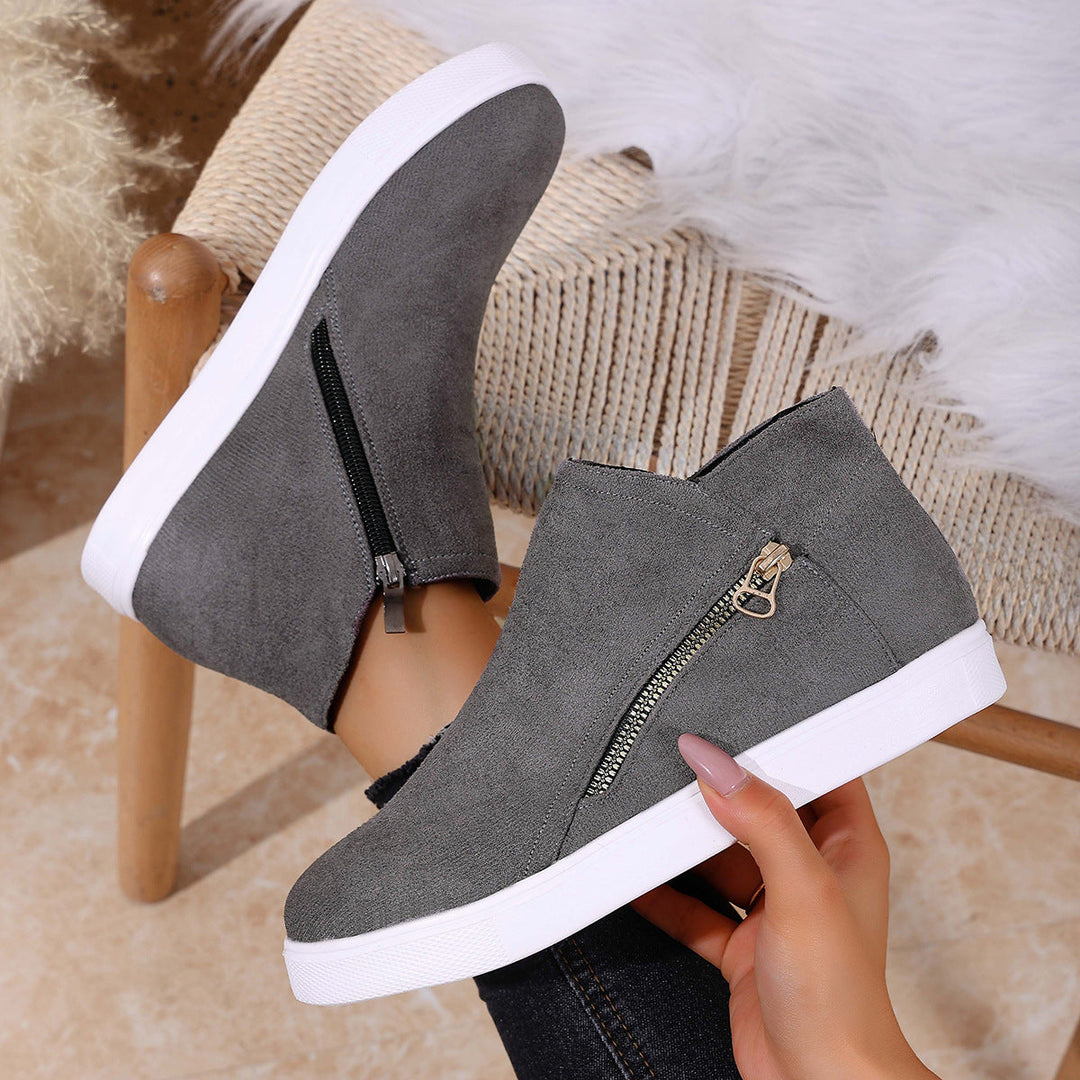 Women's versatile orthopedic shoes in white, showcasing the convenient zip-up design for comfort.