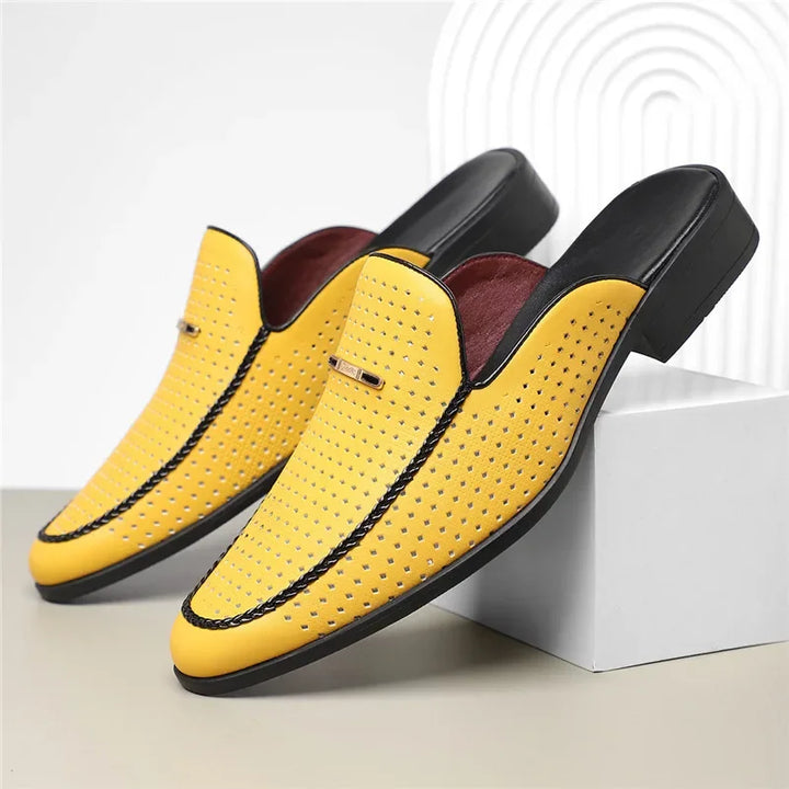 High-angle view of women's pristine perforated leather mules, ready to wear