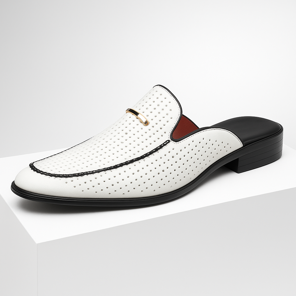 Detailed shot of the perforated texture on women's leather slip-on mules in natural light