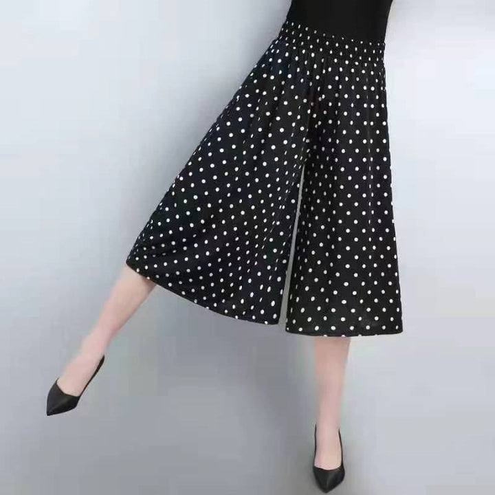 Comfortable women's polyester culottes, high elastic waist, wide leg design, and stylish pleats.