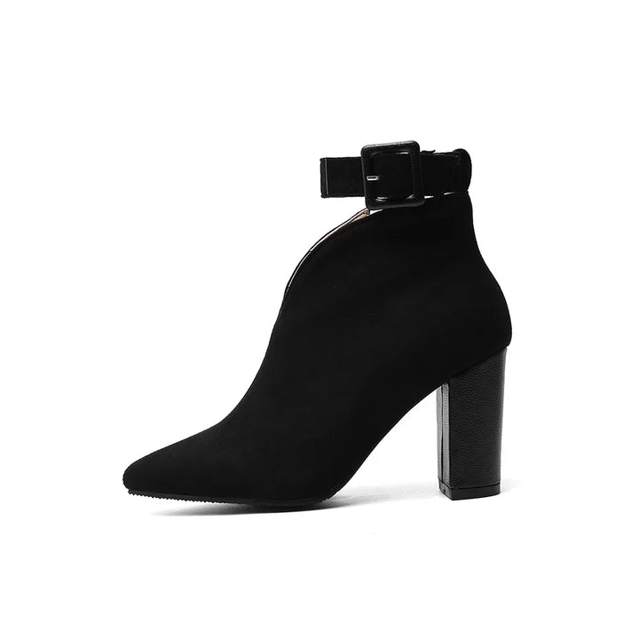 Elegant women's pointed toe ankle boots with a sophisticated buckle design in black