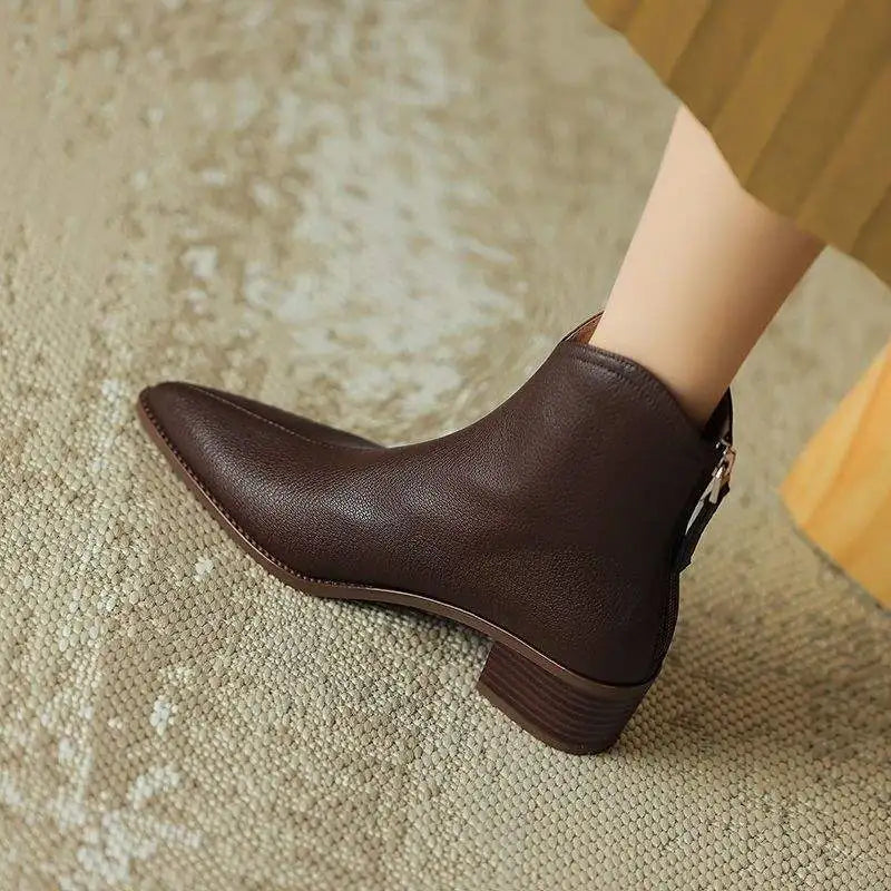 Elegant women's pointed toe low heel ankle boots, perfect for office wear.