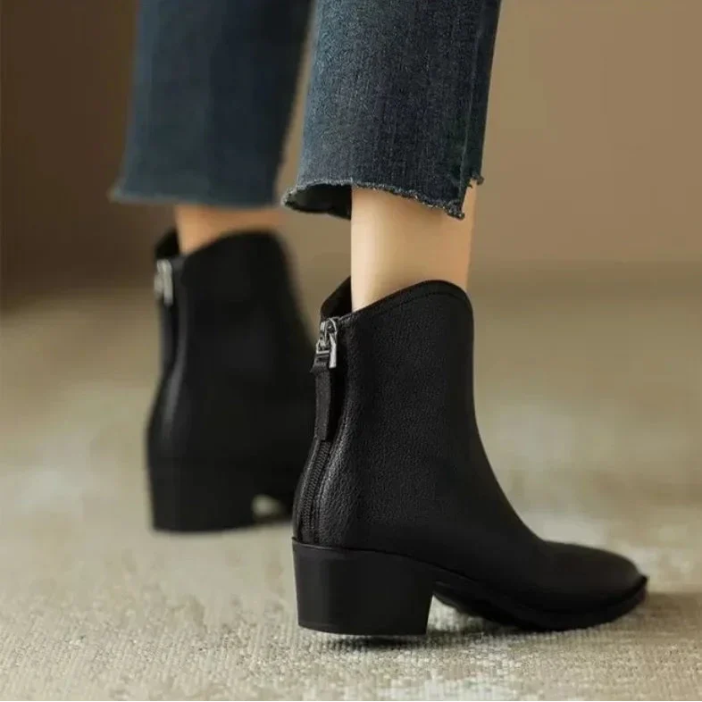 Brown slip-on women's ankle boots, pointed toe, low heel, ideal for fall fashion.
