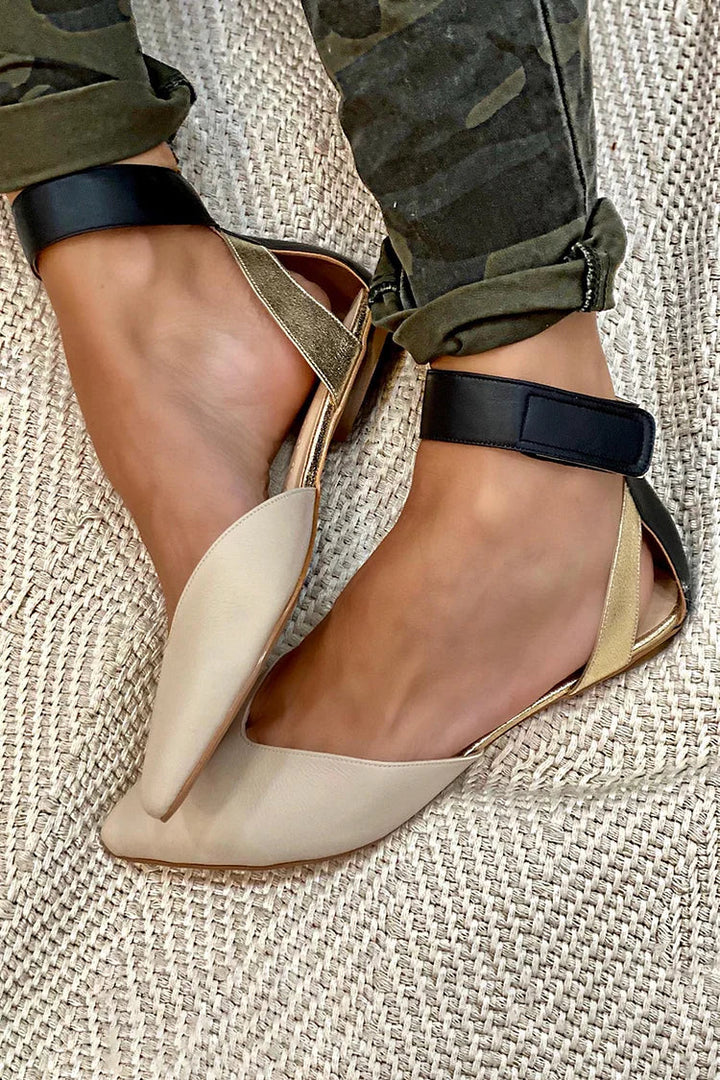 Women's black pointed-toe ankle strap flats, ideal for professional office wear, comfortable and stylish.