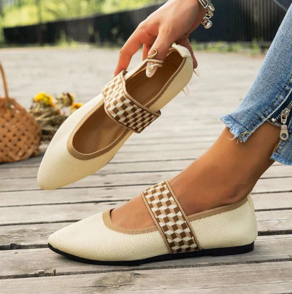 Stylish women's pointed toe ballet flats in a neutral color, perfect for spring casual outfits