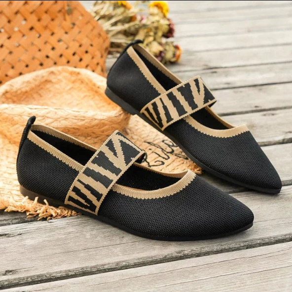 Women's pointed toe ballet flats in a light color, suitable for various casual to dressy occasions