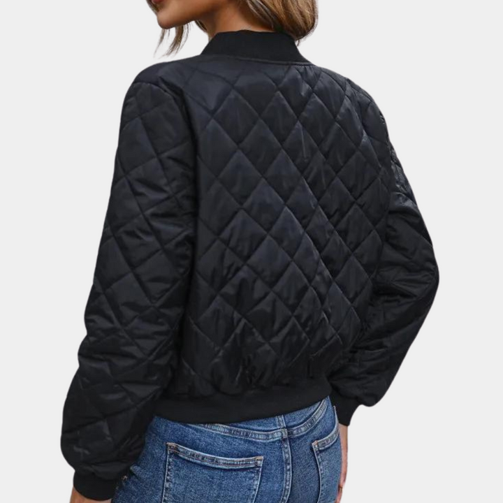 Stylish women's transitional quilted bomber jacket, featuring a secure zip closure