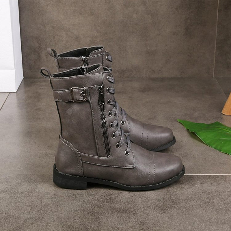 Detail shot of the tough sole on women's side-zip combat boots, rugged wear