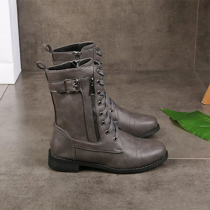 Detail shot of the tough sole on women's side-zip combat boots, rugged wear