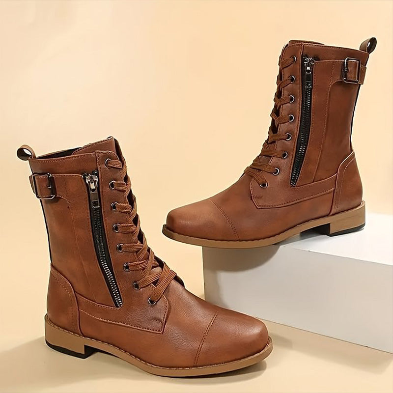 Rugged and chic women's combat boots, featuring a prominent side-zip design