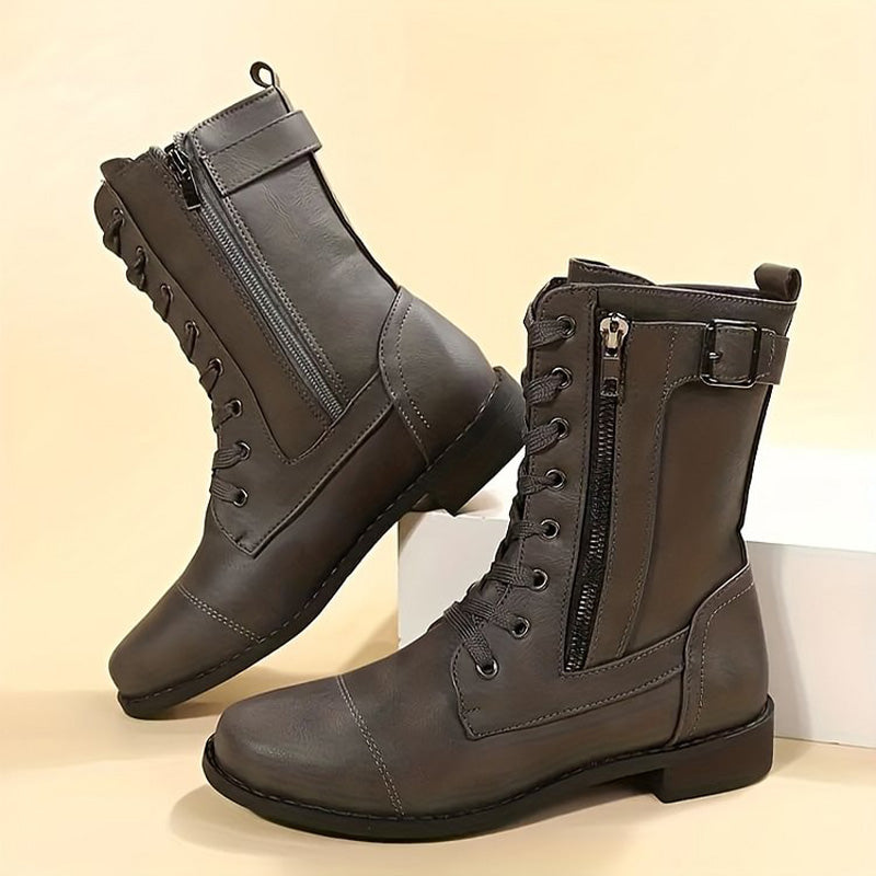 Versatile black combat boots for women, with a modern and convenient side-zip