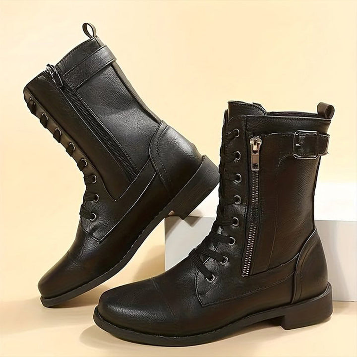 Pair of women's combat boots with side zipper, perfect for winter and fall