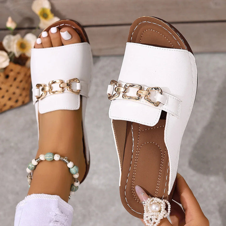 Women's summer sandals, black slide style with eye-catching gold chain accent