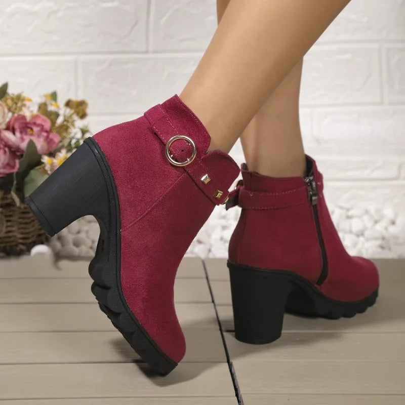 Front view of women's studded block heel boots, a chic choice for fall fashion