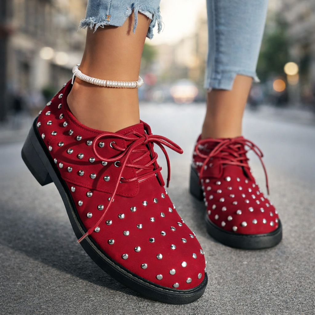 Women's black studded lace-up oxford shoes with comfortable orthopedic support, perfect for casual wear.