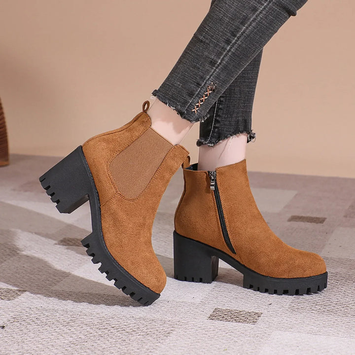 Women's black suede ankle boots with comfortable block heel, perfect for fall fashion