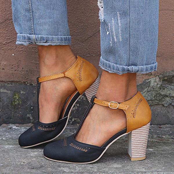 Women's black T-strap block heel shoes with ankle buckle, perfect for elegant formal or casual wear.