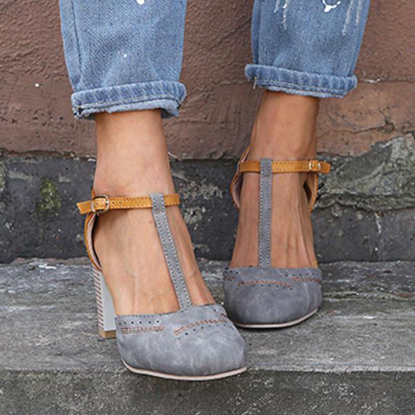 Formal women's T-strap block heels with ankle strap, offering comfortable support and chic appearance.