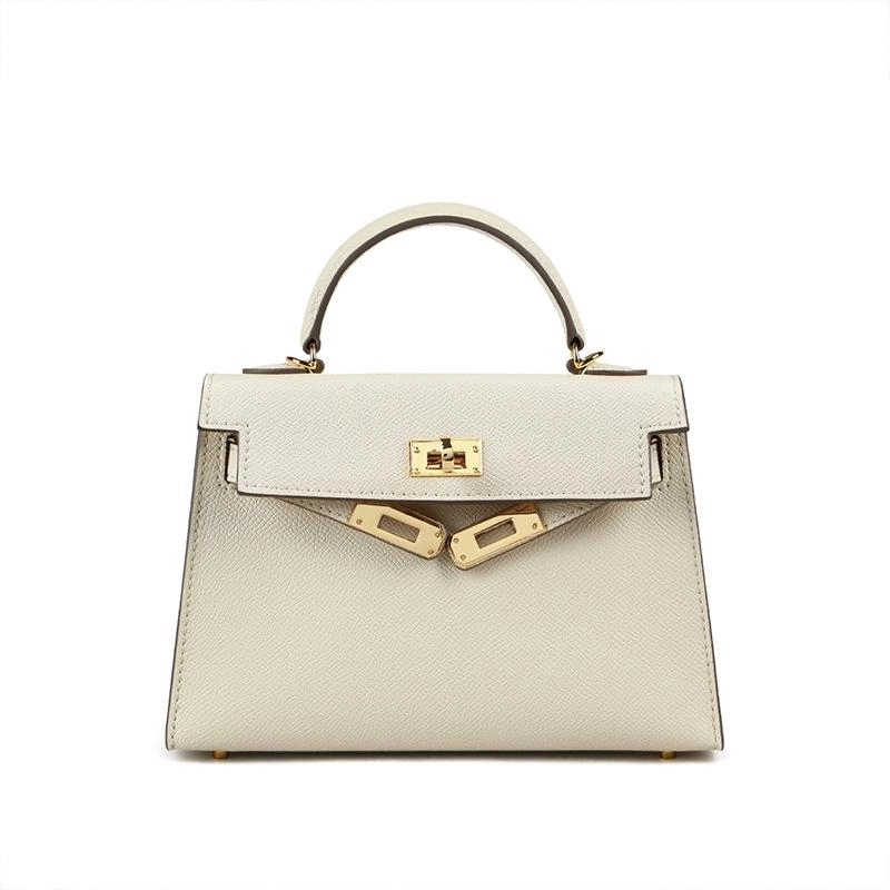 Fashionable women's crossbody shoulder bag. Ideal for everyday use with top handle & secure turn lock. Versatile handbag.