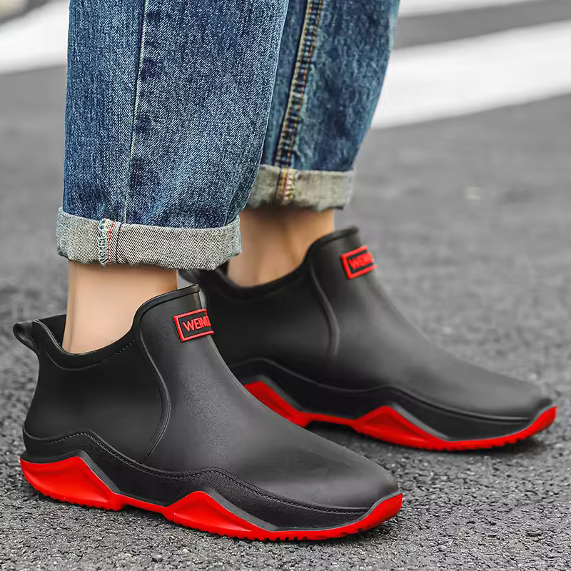 Chic women's slip-on ankle rain boots, fully waterproof for stylish protection against wet weather.