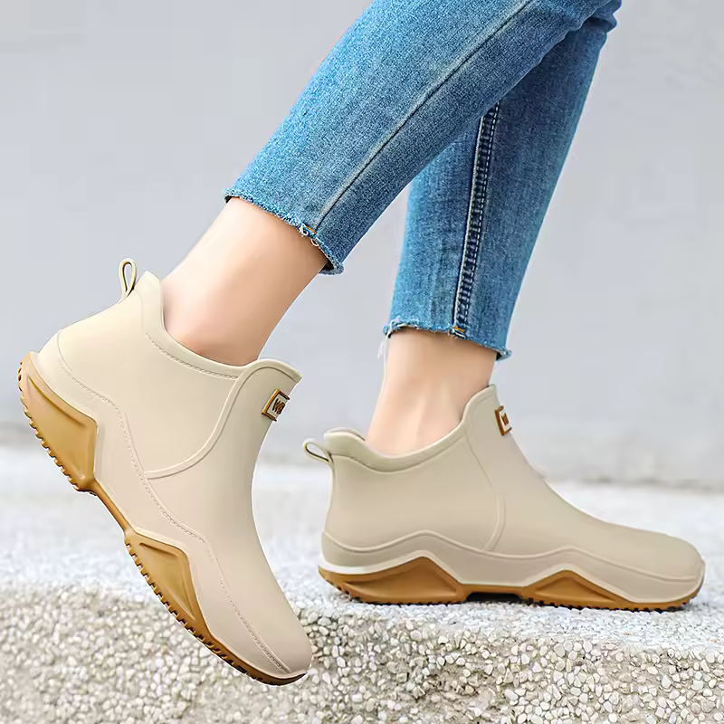 Durable women's slip-on ankle rain boots, offering waterproof protection & comfort for any wet journey.
