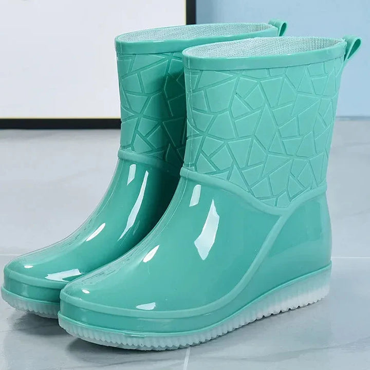 Pair of women's durable waterproof winter boots, slip-resistant for wet conditions
