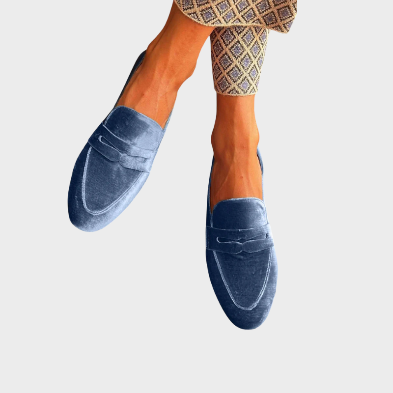 Women's blue slip-on loafers, perfect for effortless style and everyday comfort. Versatile casual flats.