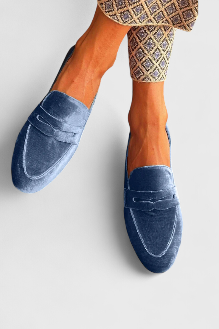 Classic women's blue slip-on loafers, ideal for casual wear or work. Stylish, comfortable women's footwear.