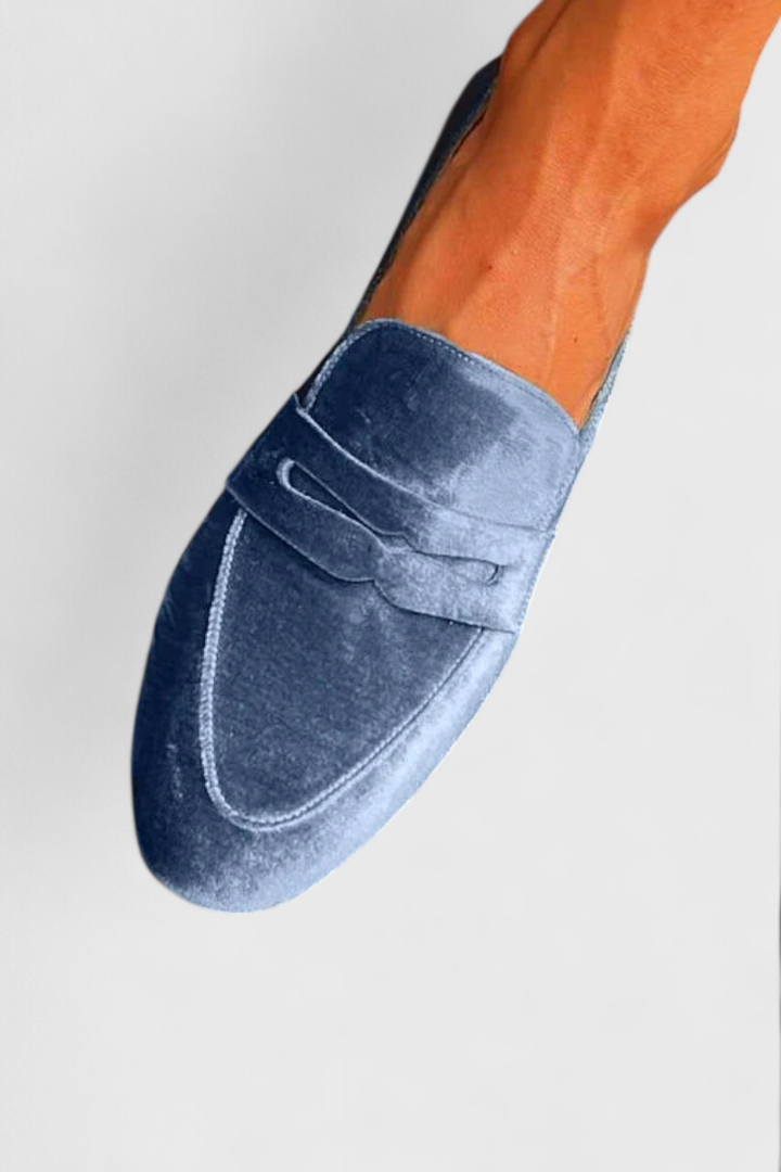 Stylish blue women's slip-on loafers. Comfortable everyday flats for versatile fashion and easy casual wear.