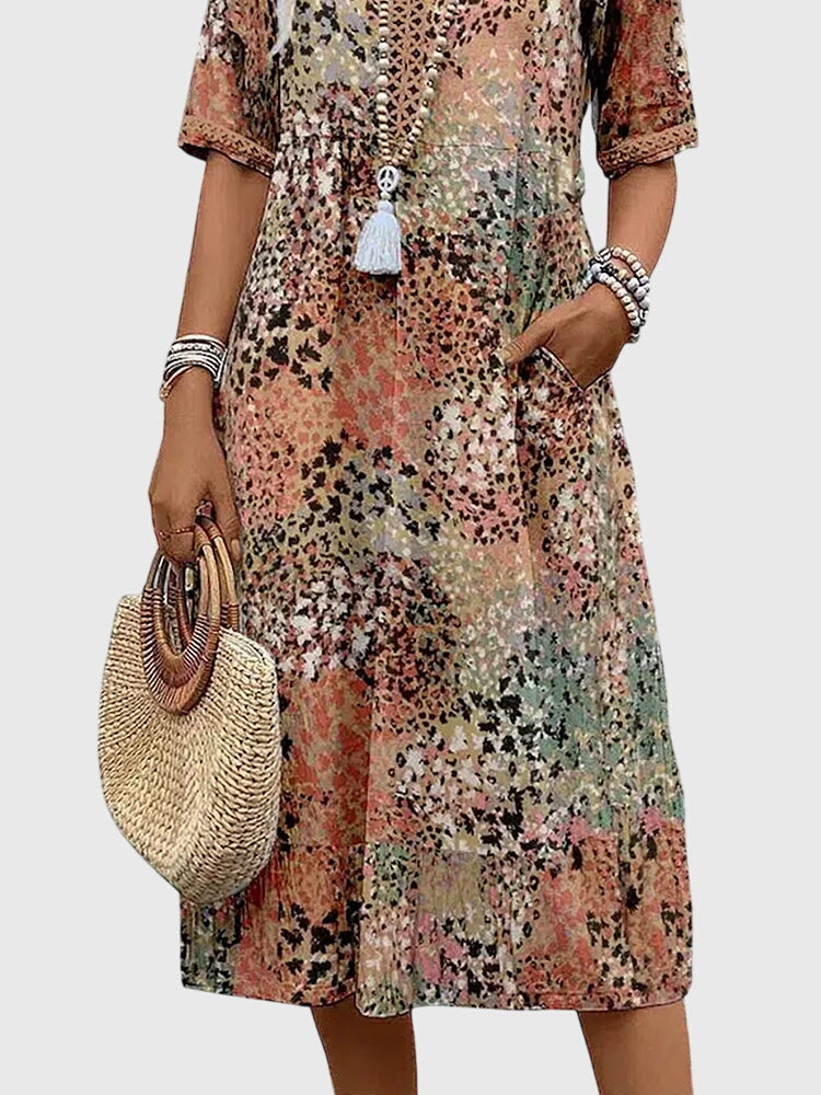Elegant abstract print midi dress for women, with a V-neck, flutter sleeves, perfect for bohemian summer style.