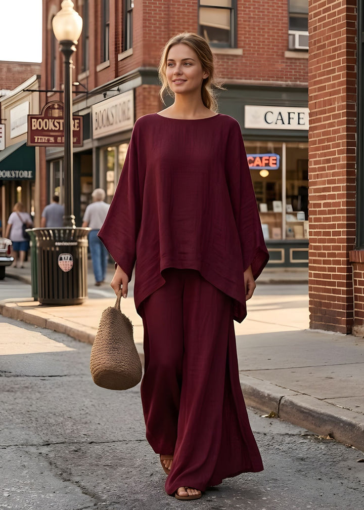 Bohemian chic women's two-piece set with a unique cape top and elegant wide-leg pants. Stylish summer outfit.