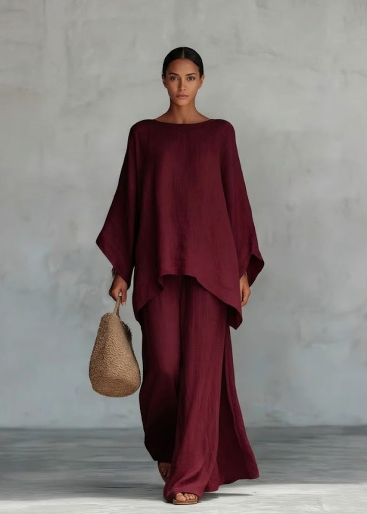 Women's stylish two-piece set: bohemian cape top & flowy wide-leg pants, great for summer resort fashion.