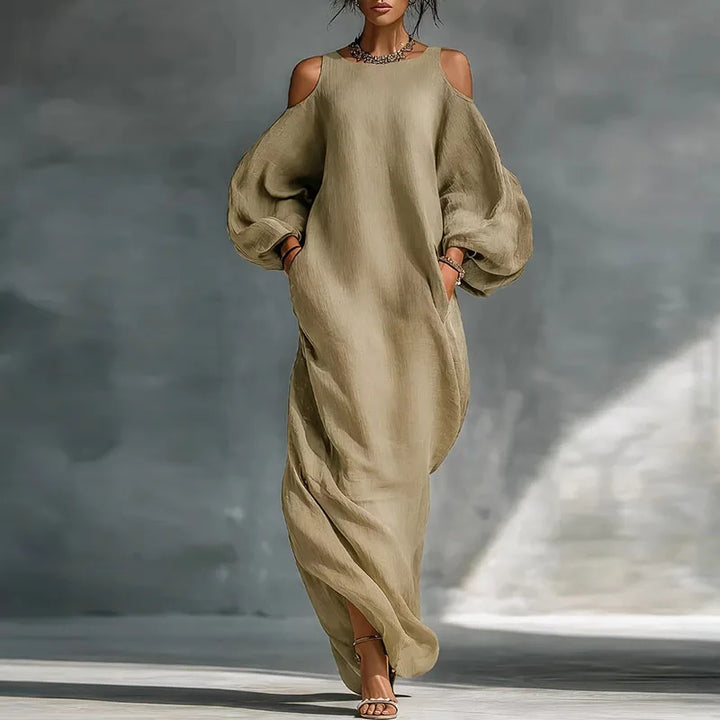 Elegant women's bohemian cold shoulder maxi dress with long sleeves, ideal for resort wear or vacation style.