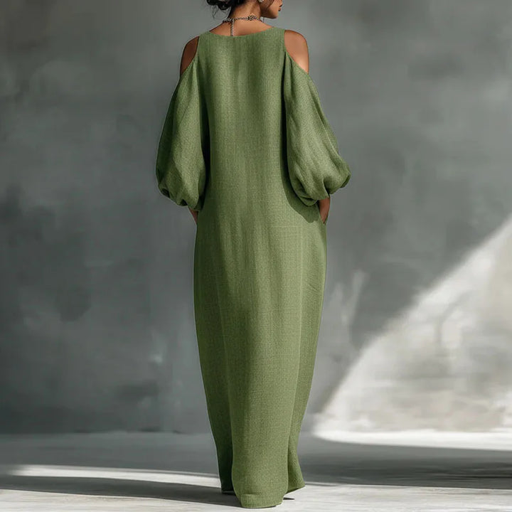 Chic women's bohemian cold shoulder maxi dress. Long sleeves & relaxed fit for a stylish, airy summer look.