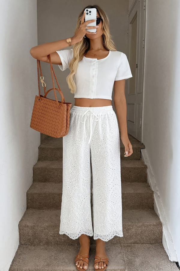 Comfortable women's cropped bohemian pants with eyelet detail. Ideal for warm weather, summer fashion, vacation wear.