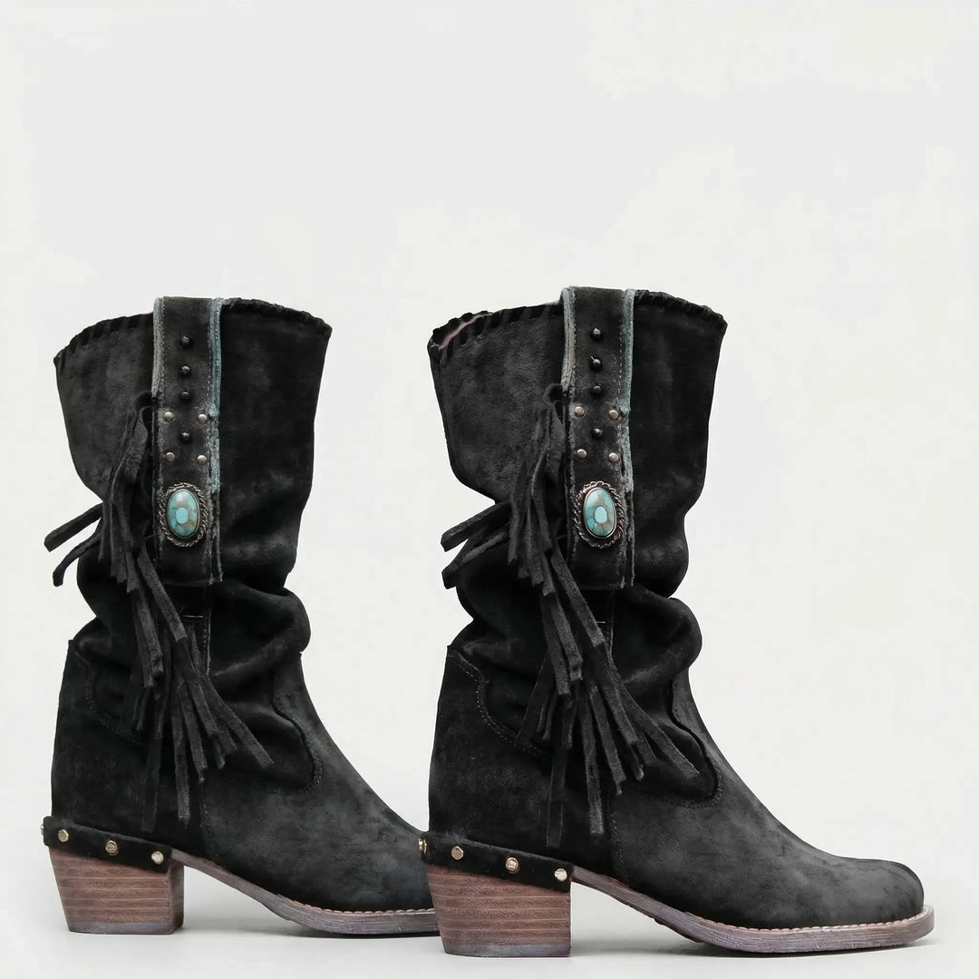 Slouchy mid-calf women's boots, featuring bohemian fringe, pointed toe, and block heel for Western flair.