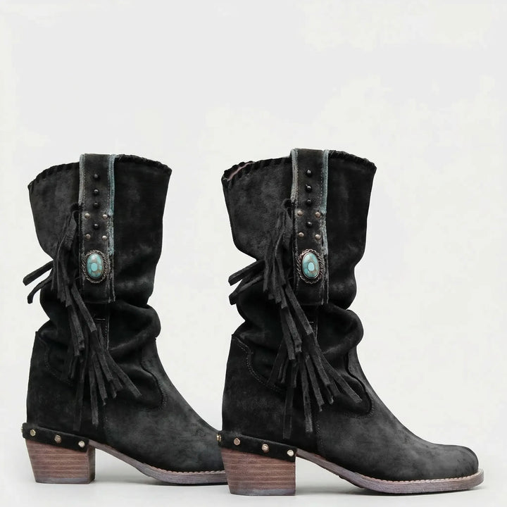 Slouchy mid-calf women's boots, featuring bohemian fringe, pointed toe, and block heel for Western flair.