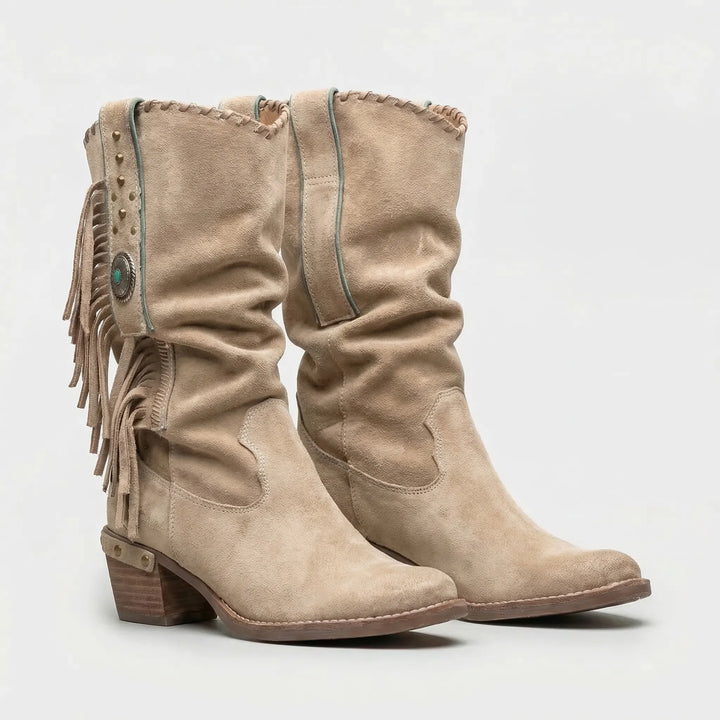 Modern cowgirl mid-calf boots for women, with trendy fringe, a pointed toe, and comfortable block heel.