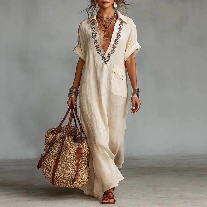 Women's bohemian printed maxi dress with deep V-neck, perfect for summer vacations & beachwear.