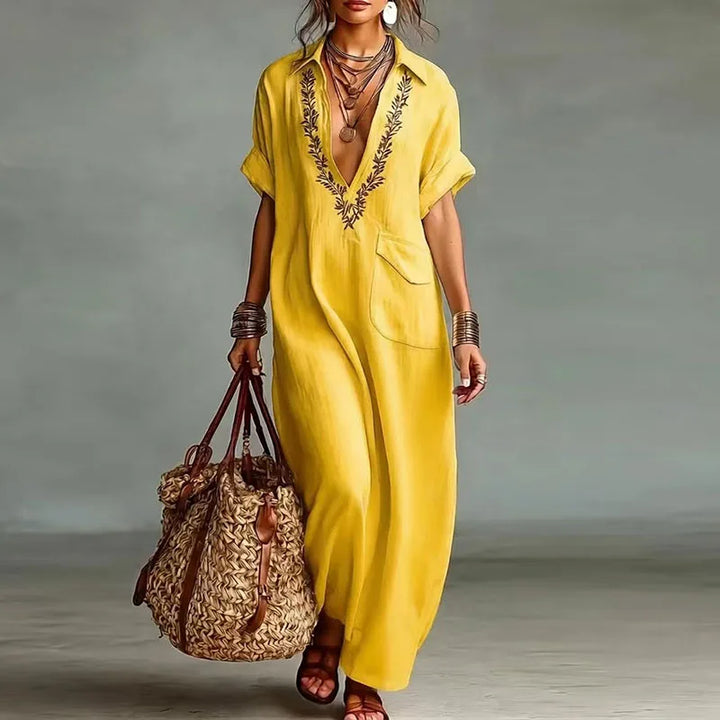 Elegant short-sleeve women's maxi dress. Bohemian print, deep V-neck, comfortable for beach or vacation.