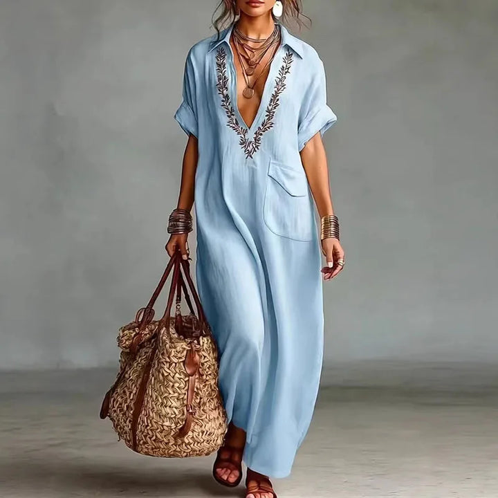 Comfortable women's deep V-neck bohemian maxi dress. Vibrant print, short sleeve, ideal for summer beach days.