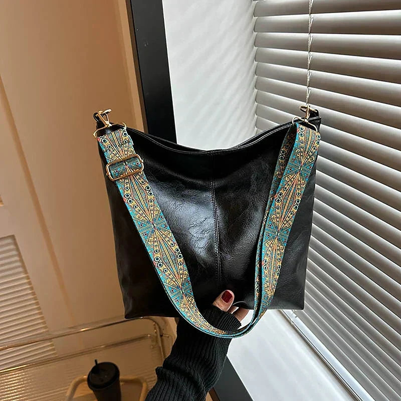 Fashionable women's bohemian handbag, an essential accessory featuring a unique patterned strap.