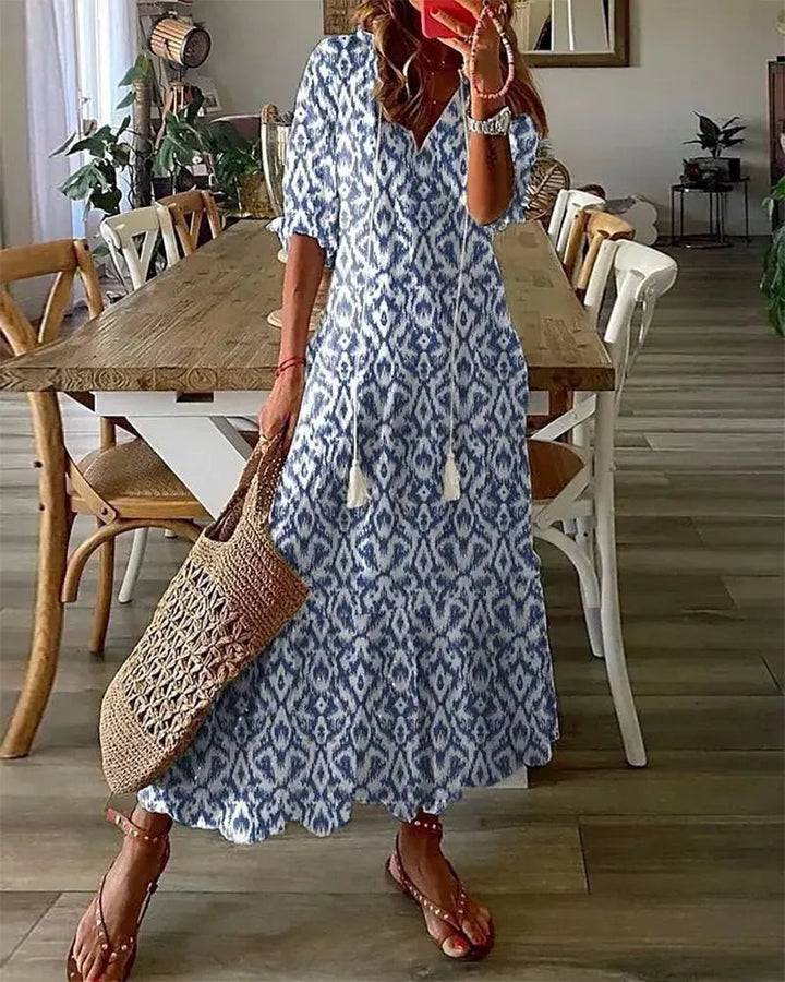 Women's boho A-line dress with flattering fit, geometric print, and chic V-neck; ideal casual summer midi dress.